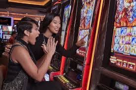 Filipino player browsing oklotto jackpot slot games on a smartphone in the Philippines